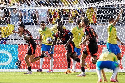 Daniel Munoz celebrates after scoring his side's first goal 